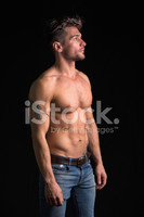 49385500-handsome-shirtless-muscular-man-on-black