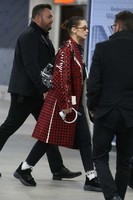 bella-hadid-wears-in-a-red-checkered-pvc-coat-at-milan-airport-in-milan-4-683x1024