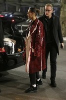 bella-hadid-wears-in-a-red-checkered-pvc-coat-at-milan-airport-in-milan-5-683x1024