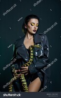 stock-photo-beauty-woman-python-yellow-snake-around-her-neck-on-latex-shiny-raincoat-yellow-snake-on