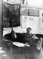 Pablo Picasso with his cat in his studio, 1910