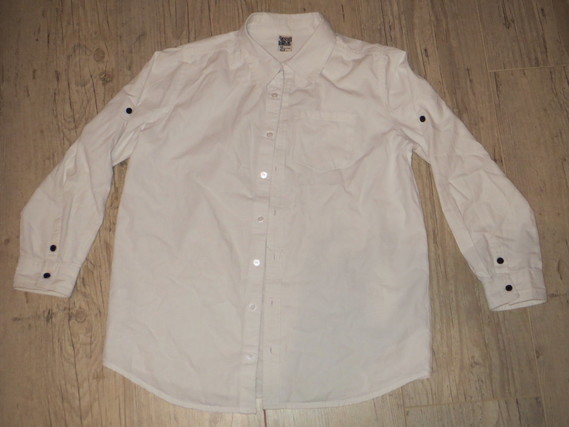 tào chemise blanche bouton noir 12a 4€