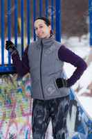 59154553-Fit-sporty-woman-outdoors-in-winter-running-gear-at-urban-park-with-graffiti-Stock-Photo