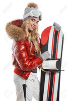 50762267-a-beautiful-woman-with-a-snowboard-in-studio-Stock-Photo