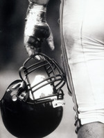 low-angle-view-of-an-american-football-player-holding-a-helmet