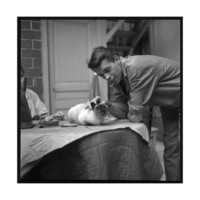 marcel-begoin-jacques-brel-cuddling-his-cat-september-1959
