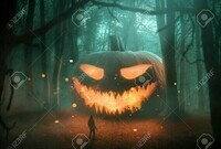 132981774-abstract-jack-o-lantern-pumpkin-in-the-dark-forest-at-night