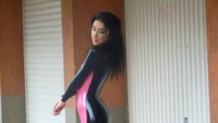 Wearing Pink and Black Latex Catsuit